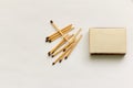 Matches,matchbox and the matches scattered on a white background Royalty Free Stock Photo