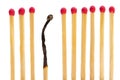 Matches on a row with one burned Royalty Free Stock Photo