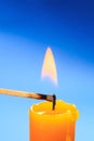 Matchstick burning candle closeup