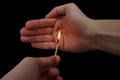 Matchstick fire in a male hands Royalty Free Stock Photo