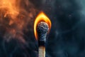 A matchstick is lit and the flame is very small. Royalty Free Stock Photo