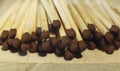 Matchsticks with brown tips on a birch board macro close up Royalty Free Stock Photo