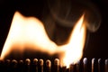 Matchsticks are burning, chain reaction with fire and flames Royalty Free Stock Photo