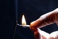 matchsticks burning side by side, black background. close-up. Royalty Free Stock Photo