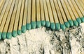 Matchsticks with green tips on a birch board macro close up Royalty Free Stock Photo