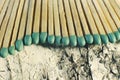 Matchsticks with green tips on a birch board macro close up Royalty Free Stock Photo