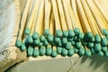 Matchsticks with green tips on a birch board macro close up Royalty Free Stock Photo