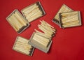 Matchsticks on a red background. Safe handling of fire. Fire dangers. Lots of matches. still life. Matchsticks boxes Royalty Free Stock Photo