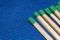 Matchsticks with a red heads with heart shaped match among others on a classic blue background. Royalty Free Stock Photo