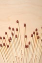Matchsticks in a row on wooden table. Royalty Free Stock Photo