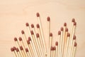 Matchsticks in a row on wooden table. Royalty Free Stock Photo