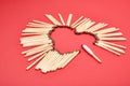 Matchsticks in the shape of a heart on red background Royalty Free Stock Photo