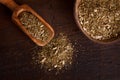 Mate with scoop on wooden background