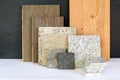 Material collage with natural stone, tiles and wooden parquet floor for renovation of an apartment building Royalty Free Stock Photo