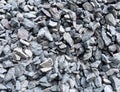 Material coral stone for the road foundation layer. Closeup of a pile of crushed stone texture background. Coarse gravel stone Royalty Free Stock Photo
