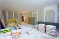 Materials for construction putty packs, sheets of plasterboard or drywall in apartment is under construction Royalty Free Stock Photo
