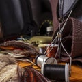 Materials and tools for tying lures on a wooden table. Fly Fishing Still Life. Royalty Free Stock Photo