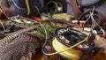 Materials and tools for tying lures on a wooden table. Fly Fishing Still Life. Royalty Free Stock Photo