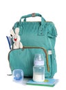 Maternity backpack with baby accessories on white