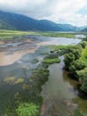 Drone-captured photograph at Lake Matese, Campania, Italy, featuring an aerial view of the lake, mountains