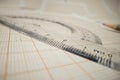 Math concept - macro of a pencil on a piece of paper with geometric measurement tool Royalty Free Stock Photo