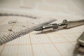 Math concept - macro of a pencil on a piece of paper with geometric measurement tool Royalty Free Stock Photo