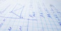 Math formulas are written in a notebook with a pen. The solution of examples and problems in a notebook Royalty Free Stock Photo