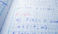 Math formulas are written in a notebook with a pen. The solution of examples and problems in a notebook Royalty Free Stock Photo