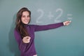 Math teacher in front of blackboard Royalty Free Stock Photo