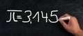 The mathematical constant pi 3,145 is standing on a chalkboard, defined in Euclidean geometry Royalty Free Stock Photo