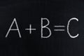 Mathematical equation with letters on chalkboard, blackboard texture