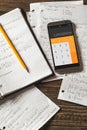 Mathematical equations written in a notebook. Calculator app. Royalty Free Stock Photo