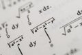 Mathematical Formulas and Equations in Textbooks Featuring Integrals, Square Roots, and Parametric Functions