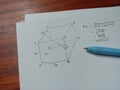 Geometry Problem Solving on A White Paper with Opened Blue Pen on It