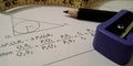 mathematical solution with geometric diagrams displayed on white paper sheet with educational tools