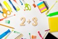 Mathematics. numbers 2 plus 3 on the school desk. concept of education. back to school. stationery. White background. stickers, co Royalty Free Stock Photo