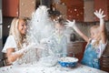 Mather daughter and son throws flour in each other