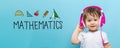 Mathmatics with toddler boy with headphones Royalty Free Stock Photo