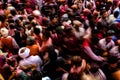 Mathura, Uttar Pradesh, India- January 6 2020: crowd of mathura celebrating holi by playing with colors captured in slow shutter Royalty Free Stock Photo