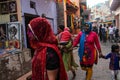 Mathura, Uttar Pradesh/ India- January 6 2020: Indian women celebrating Holi by playing with colors in the streets of mathura