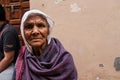 Mathura, Uttar Pradesh/ India- January 6 2020: portrait of an old woman with wrinkled face celebrating holi on the street of