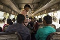 Ticket man and people in bus in India