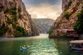 Matka, Macedonia - August 26, 2018: Canyon Matka near Skopje with people kayaking and amazing foggy scenery