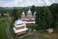 Aerial view on ancient wooden Church of Synaxis of the Holy Mother of God in Matkiv, Lviv region, Ukraine from drone Royalty Free Stock Photo