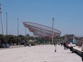 Matosinhos beach front path in Porto, Portugal, with Anemona fishing net monument to fishermen Royalty Free Stock Photo