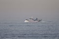 Matosinhos, Portugal - September 29, 2015: Taditional portuguese sardine fishing wooden trawler sailing towards Leixoes harbor in Royalty Free Stock Photo