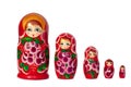 Matreshka Russian doll souvenir bright red, purple and green flowers pattern on white background isolated closeup