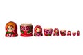 Matreshka Russian doll souvenir bright red, purple and green flowers pattern on white background isolated closeup