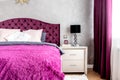 Matrimonial bed in elegant and comfortable modern bedroom. Interior design details