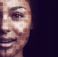 The matrix of beauty. Concept portrait of a young woman with a grid overlay on her face.